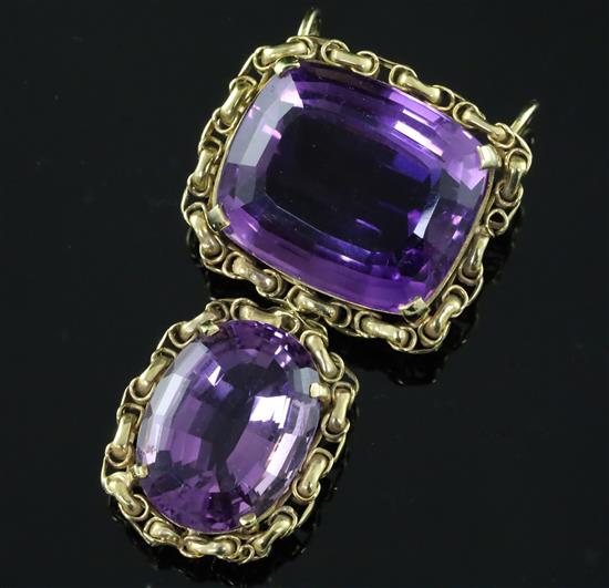 A gold and two stone amethyst set drop pendant, 45mm.